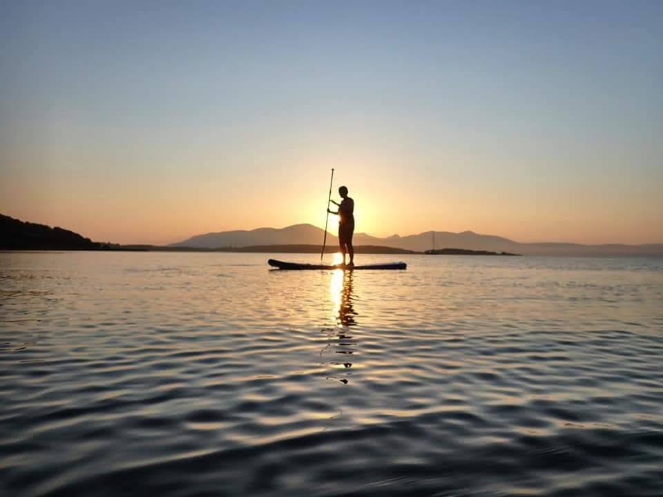 Paddle boarding on Torrisdale Bay at sunrise